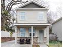 Charming two-story home with stone accents and a welcoming front porch, enhancing curb appeal at 1766 15Th Street Ne Pl, Hickory, NC 28601