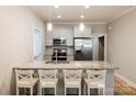 Bright kitchen featuring a granite island, stainless steel appliances, and pendant lighting at 1766 15Th Street Ne Pl, Hickory, NC 28601