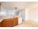 Spacious kitchen featuring wood cabinets, a white dishwasher and plenty of counter space at 1991 9Th Street Se Pl, Hickory, NC 28602