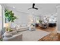 Bright and spacious living room featuring hardwood floors, neutral decor, and an open concept design at 2721 Kilgo Way, Charlotte, NC 28205
