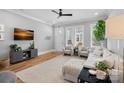 Comfortable living room with ample seating, natural light, and hardwood floors, perfect for relaxation at 2721 Kilgo Way, Charlotte, NC 28205