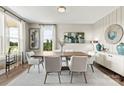 Bright dining room with modern decor, large windows, and stylish furnishings at 318 Balboa St, Matthews, NC 28104