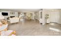 Open-concept space with hardwood flooring, fireplace, living, and dining areas at 534 Kirby Ln, Matthews, NC 28104