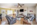 Cozy living room boasts hardwood floors, ceiling fan, and comfortable seating arrangement at 5485 S Nc 16 Hwy, Maiden, NC 28650