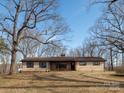 Charming single-story home with stone accents and a cozy front porch surrounded by bare winter trees at 5534 Little Mountain Rd, Catawba, NC 28609