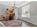 Comfortable office space with natural light, wood desk, and modern decor at 571 Rough Hewn Ln, Rock Hill, SC 29730