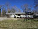 Cozy single-story home with a well-maintained lawn and exterior at 5924 Freedom Dr, Charlotte, NC 28214
