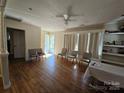 Bright living room with hardwood floors, seating area, and natural light at 5924 Freedom Dr, Charlotte, NC 28214