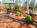 Cozy outdoor living space with a dining set and lush greenery at 9331 Hanworth Trace Dr, Charlotte, NC 28277