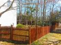 Wood fence lines the backyard offering privacy to enjoy the outdoors at 9331 Hanworth Trace Dr, Charlotte, NC 28277