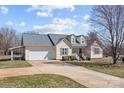 Inviting curb appeal with a well-manicured lawn, a spacious driveway, and an attached garage, ready to welcome you home at 111 Lynnette Dr, Mt Ulla, NC 28125