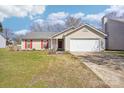 Charming single-story home with vinyl siding, attached garage, and well-maintained front yard at 14429 Planters Knob Ln, Charlotte, NC 28273