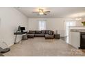Spacious living room with a ceiling fan and lots of natural light at 2026 Talbert Ct, Charlotte, NC 28214