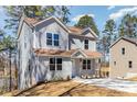 Two-story home with gray siding and brown roof, complemented by a well-kept lawn at 2206 Hillcrest Ave, Albemarle, NC 28001