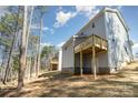 Rear exterior view of home showing newly constructed wood decks at 2206 Hillcrest Ave, Albemarle, NC 28001