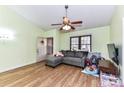 Inviting living room with wood floors, a gray sectional sofa, and lots of natural light at 2652 Gabriel Ct, Fort Mill, SC 29715