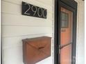 Close-up showcasing the house number, mailbox, and a vibrant orange front door at 2900 Morson St, Charlotte, NC 28208