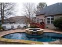 Pool and patio area with lounge chairs and a dining set at 4006 Hickory View Dr, Fort Mill, SC 29707