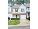 Charming townhouse featuring neutral siding, green shutters, and a one-car garage nestled in a tree-lined community at 4586 Antelope Ln, Charlotte, NC 28269