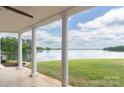 Covered back porch with lake views and beautiful columns at 627 Birdie Ln # 21/22, Norwood, NC 28128