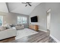 Bright living room boasts high ceilings, modern decor, and hardwood floors at 7595 Lakehaven Dr, Denver, NC 28037