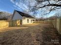 Spacious backyard with a new wood fence, perfect for outdoor activities and privacy at 803 Fargo Dr, Concord, NC 28027