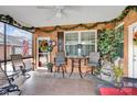 Relaxing screened porch featuring outdoor seating, charming decorations, and a view of the backyard at 8439 Sonata Ct, Denver, NC 28037