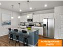 Modern kitchen featuring a spacious island with seating, stainless steel appliances, and ample cabinet space at 1101 Red River Dr, Salisbury, NC 28144