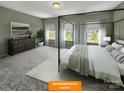 Serene bedroom with a four-poster bed, soft carpet, natural light, and neutral decor at 1101 Red River Dr, Salisbury, NC 28144