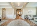 Elegant foyer with hardwood floors, arched entryway, and neutral decor creating a welcoming atmosphere at 1122 Saratoga Blvd, Indian Trail, NC 28079