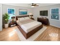 Comfortable main bedroom with hardwood floors, ceiling fan, and an en-suite bathroom at 189 Beech Brook Ln, Statesville, NC 28625