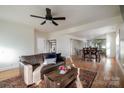 Bright living room features hardwood floors and an open concept connecting to the dining area at 1937 Wilmore Dr, Charlotte, NC 28203