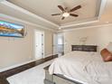 Spacious main bedroom boasts tray ceilings and a cozy rug at 2100 Bluebonnet Ln, Matthews, NC 28104