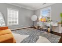 Well-lit office space with modern decor and large windows at 2100 Bluebonnet Ln, Matthews, NC 28104