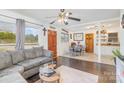 Cozy living area with comfortable seating, hardwood floors, and seamless transition to dining area at 2320 Monterey Park Dr, Gastonia, NC 28054