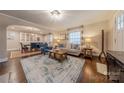 Open concept living room showcasing hardwood floors and view into dining area at 304 W Park Ave, Charlotte, NC 28203