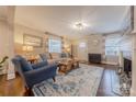 Inviting living room featuring hardwood floors, a fireplace, and a comfortable sitting area at 304 W Park Ave, Charlotte, NC 28203
