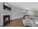 Spacious living room has hardwood floors and features a fireplace, creating a cozy and inviting atmosphere at 3230 Yarmouth Ln, Gastonia, NC 28056