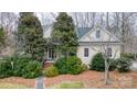 Charming home exterior with mature trees, manicured landscaping, and a welcoming front entrance at 423 Bethel Dr, Salisbury, NC 28144