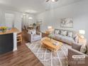Bright and airy living room with stylish furnishings, decor, and open floor plan at 9154 Bradstreet Commons Way, Charlotte, NC 28215