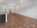 Spacious open-concept living area with hardwood floors and natural light at 9154 Bradstreet Commons Way, Charlotte, NC 28215