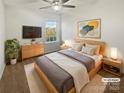 Serene bedroom featuring a comfortable bed, natural light, and minimalist decor at 9154 Bradstreet Commons Way, Charlotte, NC 28215