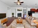 Cozy living room with fireplace, stylish furnishings, and an open floor plan at 9407 Seamill Rd, Charlotte, NC 28278