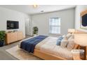 Serene bedroom with natural light, cozy rug, and modern furnishings at 9407 Seamill Rd, Charlotte, NC 28278