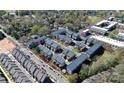 A charming neighborhood showcases well-maintained townhomes, mature trees, and meticulously kept landscaping at 1037 Pierre Dr, Charlotte, NC 28205