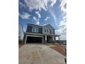 New two story home with stone accents, attached two car garage, covered porch, and desirable curb appeal at 136 Glenn Dr, Mooresville, NC 28115