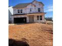Unfinished two-story home featuring a covered entrance, a two-car garage, and a new roof at 136 Glenn Dr, Mooresville, NC 28115