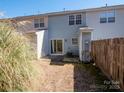 Backyard of a townhome featuring a patio and fenced-in area at 13684 Meade Glen Ct, Charlotte, NC 28273