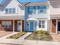 Charming townhome featuring light blue siding and well-maintained landscaping at 13684 Meade Glen Ct, Charlotte, NC 28273