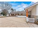 Angle view of a single-story home with a covered entryway and spacious driveway at 156 Hazelton Loop, Mooresville, NC 28117